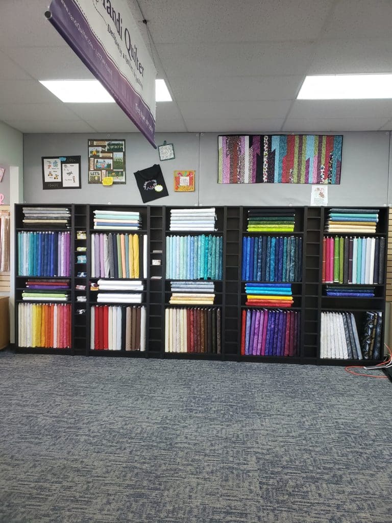 Get Sew Organized Challenge for January 2020: Fabric 10 Photo of fabric shelves at RMSV Aurora store
