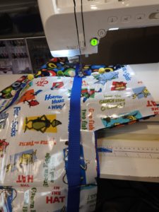 Photo of straps being sewn on laminated cotton beach bag