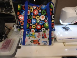 Outside of laminated cotton beach bag.