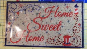 Put a Little Bling on Your Embroidery. The Brother Rhinestone Kit, Part 2. 55 Photo of rhinestone-embellished embroidery design with transfer sheet of rhinestones positioned for ironing