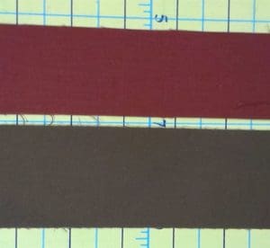 Make your Quilt Pop With Flange Binding 5 Fabric strips to be used to make flange binding. The red strip is 1 1/2" wide and the brown fabric strip is 2" wide.