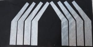 Little Miss Muffet is Making a Square Tuffet 6 Photo of interfacing for pattern pieces "2B" and "2BR" ironed on to the black fabric for the square tuffet