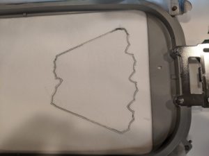 Photo of tack down stitches for fiber form for the Freestanding Holiday Wreath from OESD