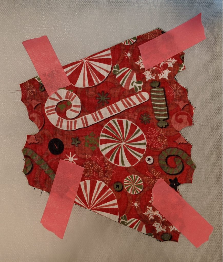 Photo of back fabric taped in place for Free Standing Holiday wreath.