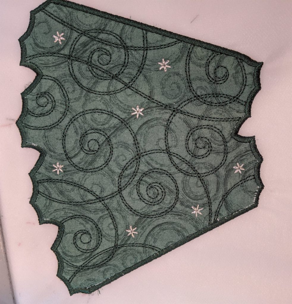 First sew out of edge stitch on Free Standing Holiday Wreath panel