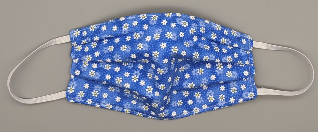 Photo of completed cotton face mask with pleats expanded