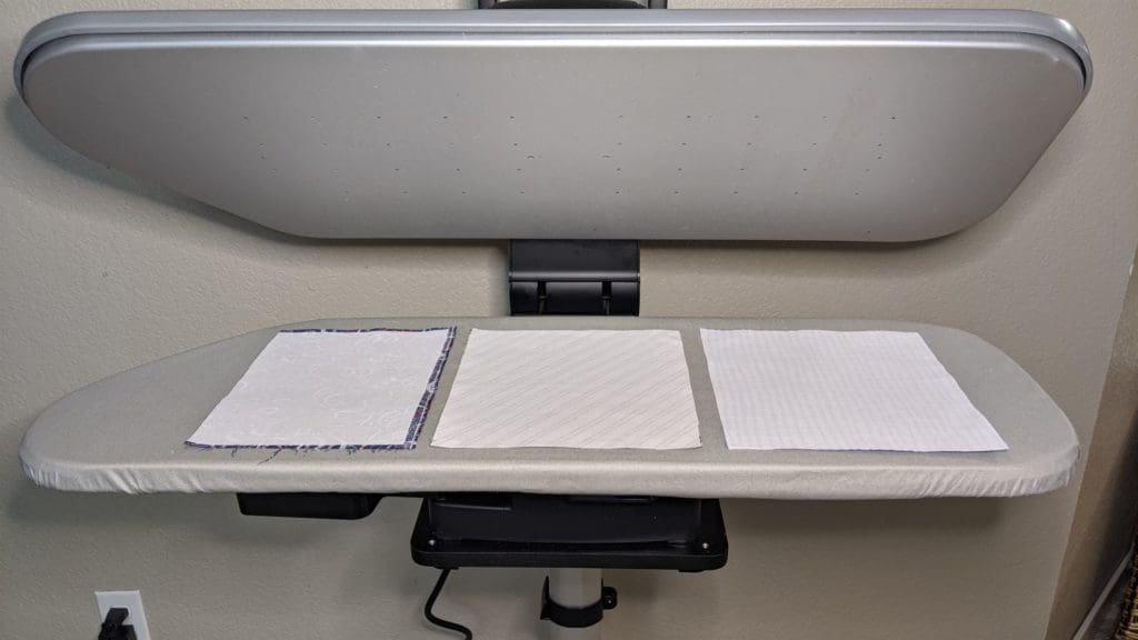 Pressing Issues: The Singer Steam Presses 2 Singer 36" Intelligent Pro Steam Press showing fusing interfacing to three pieces of fabric