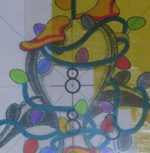 Don't Get Your Tinsel in a Tangle: Embroidering With Metallic Thread 10 close-up photo of centering transparency of design over snowman