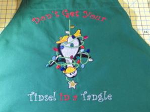 Completed embroidery with parts of design embroidered with metallic thread