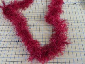 Don't Get Your Tinsel in a Tangle: Embroidering With Metallic Thread 22 Red fringe with metallic accents to be used on top and bottom hems of apron