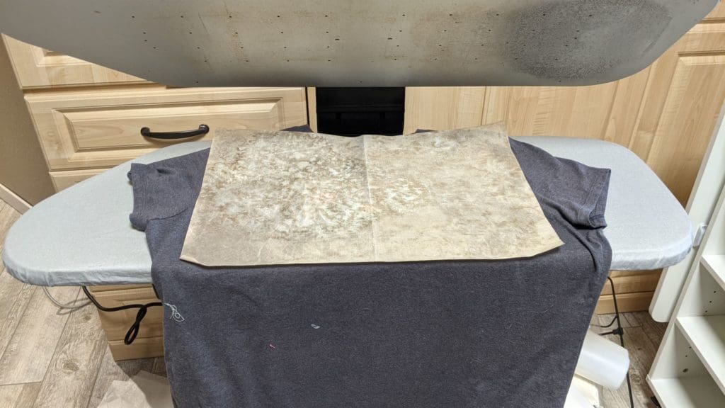 Putting on the Glitz 45 Teflon sheet on t-shirt