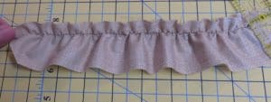 How to Gather Fabric and Create Ruffles 12 Photo of right side of ruffle created by sewing elastic to the wrong side for gathering the fabric