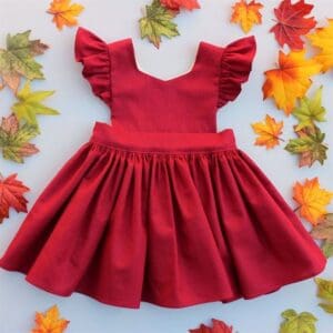 How to Gather Fabric and Create Ruffles 1 Photo of child's red pinafore dress with gathered skirt and ruffled cap sleeves
