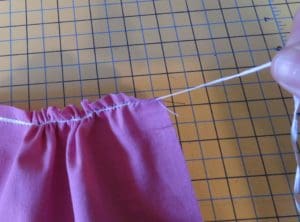 How to Gather Fabric and Create Ruffles 9 Photo of gathering fabric by pulling on dental floss to create the gathers