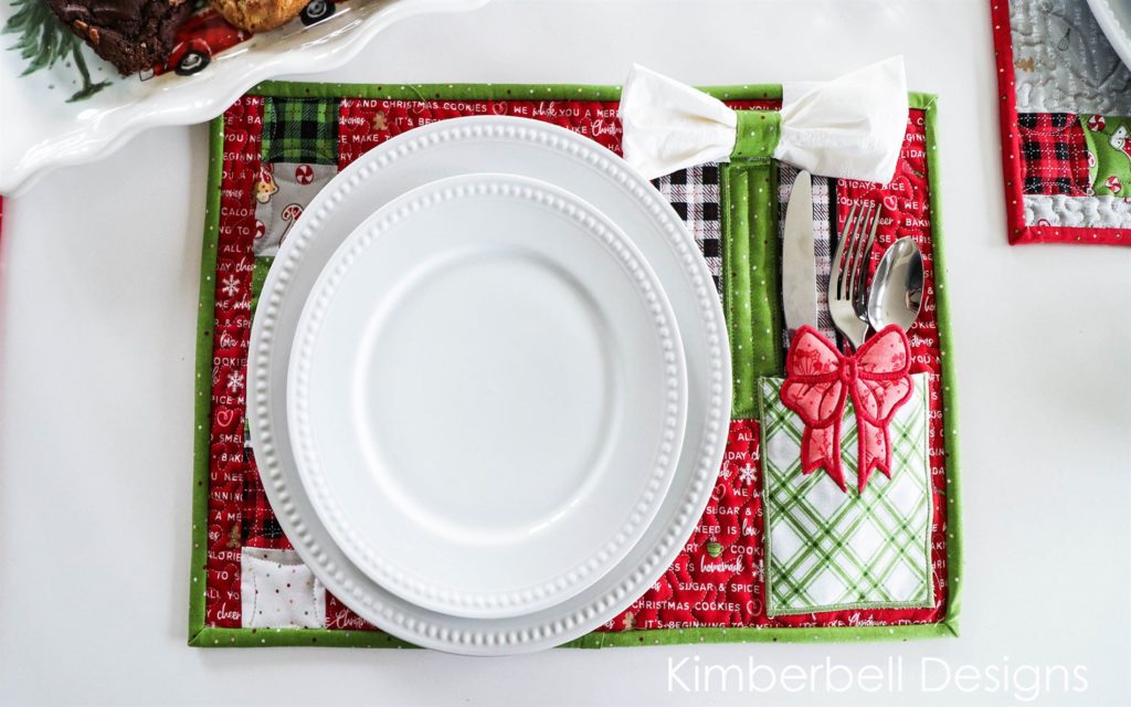 Photo of placemats made from embroidery patterns in We Whisk You a Merry Christmas from Kimberbell show in September Sew Fun