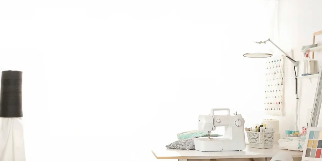 A clean sewing and craft room with a modern air purifier